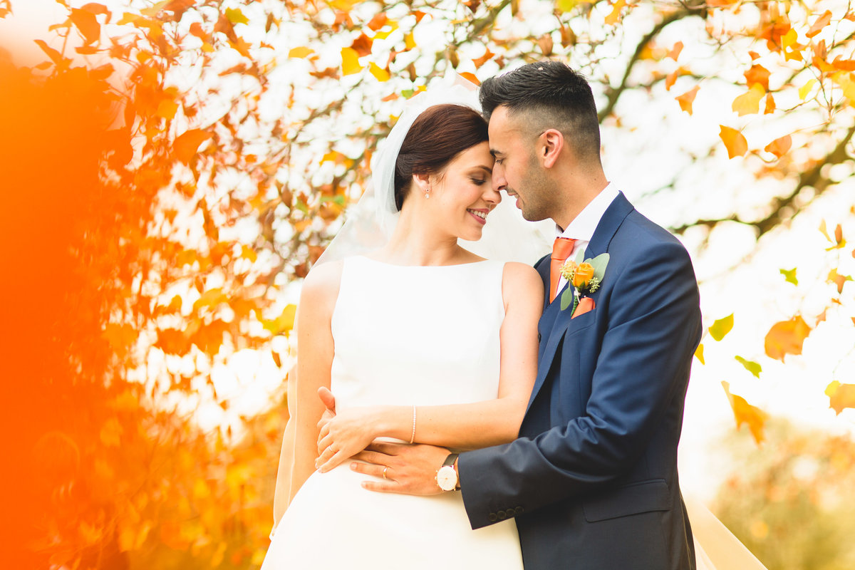 An autumn  photograph taken Iscoyd Park wedding with lots of orange from the trees