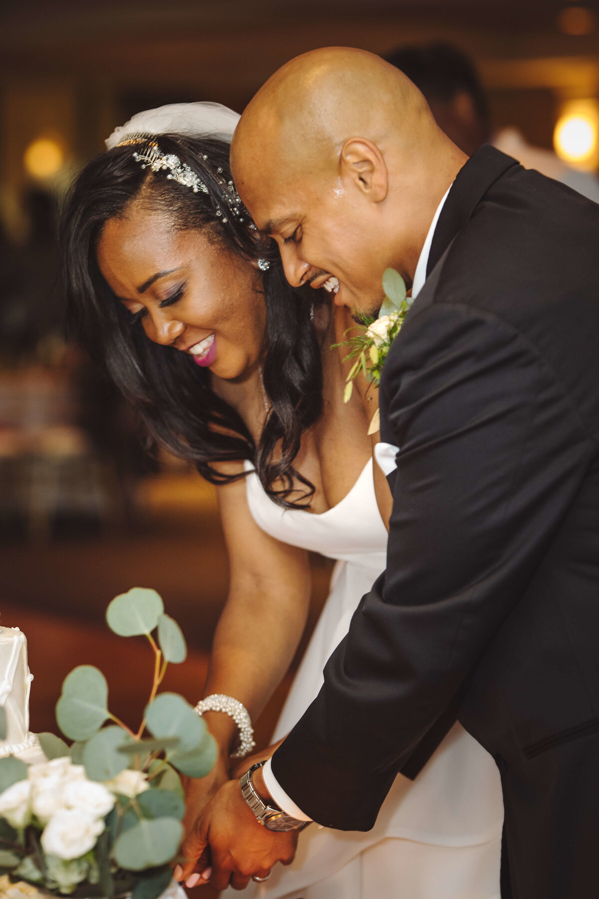 black wedding couple cutting cake