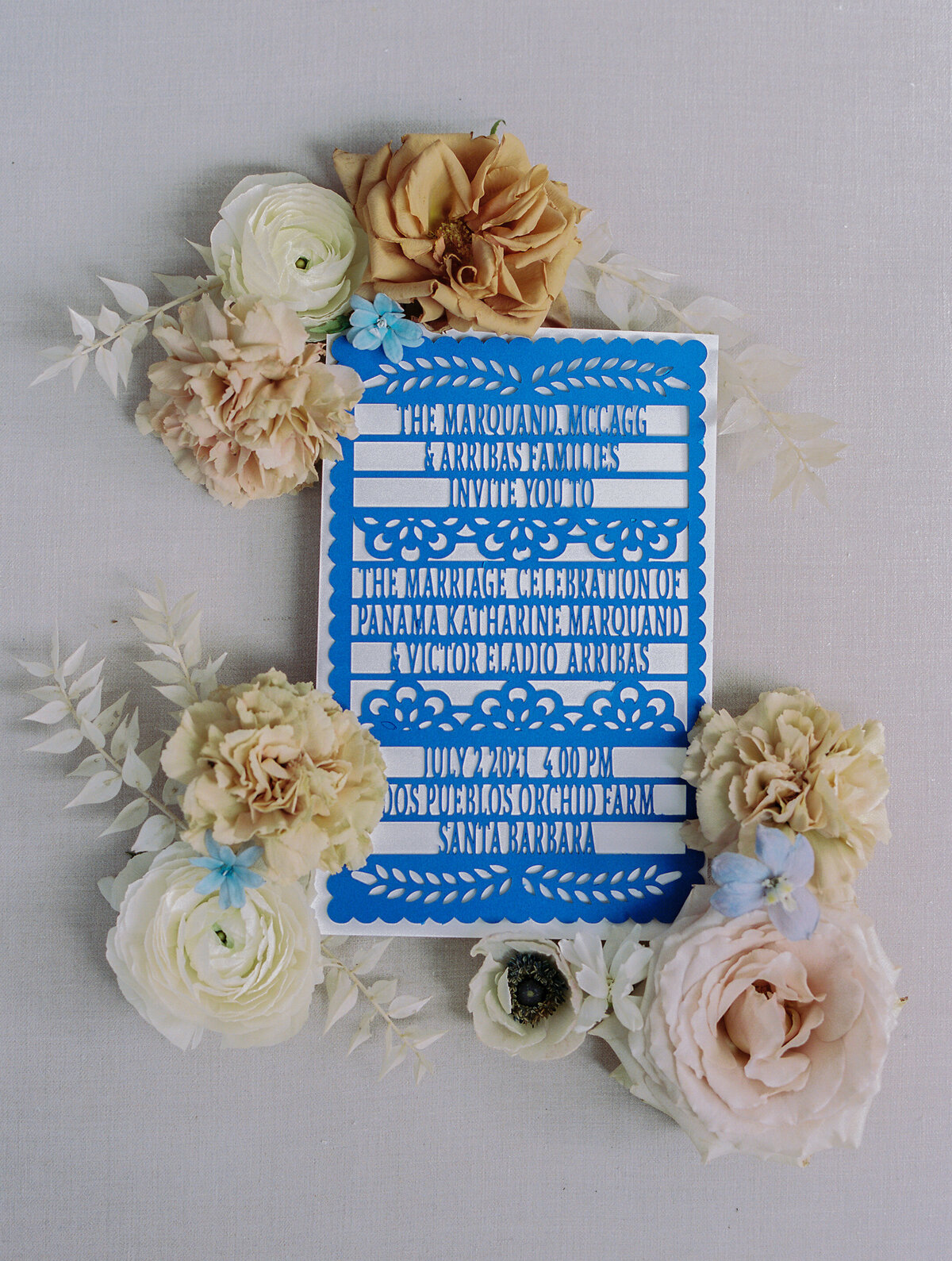 blue laser cut invite with flowers