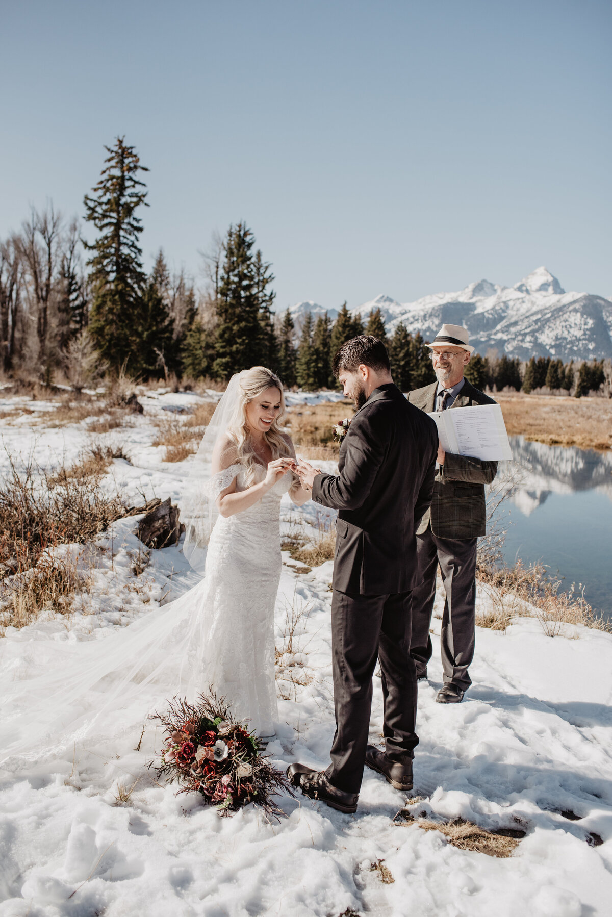 Jackson Hole Photographers capture bride putting ring on groom