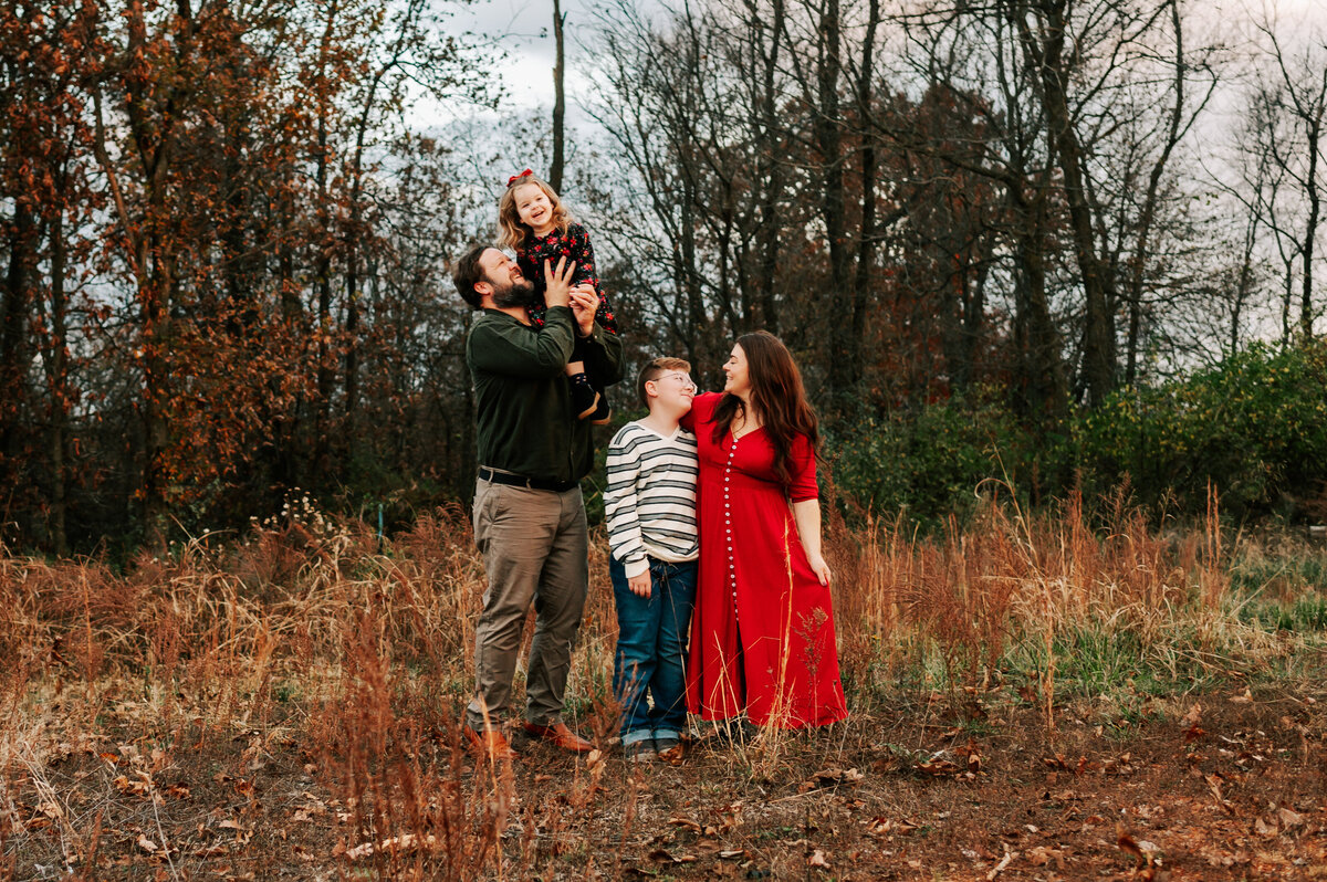 kids giggling in family photo during Springfield MO family photography session