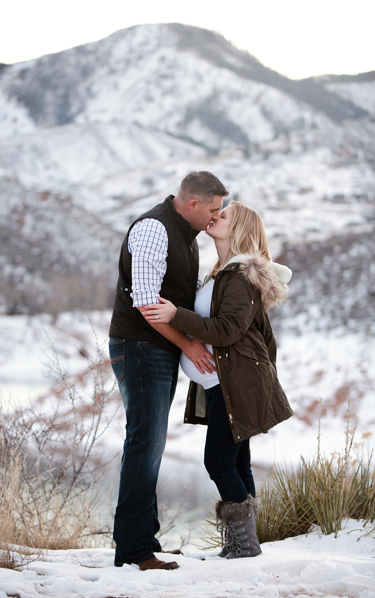 snowy mountain maternity photos in fort collins colorado