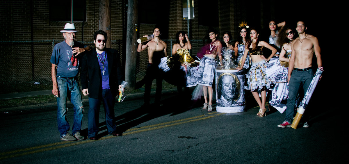 Chance Reyes and Avi (AKA Mr. Pinata) posing with their models from Una Noche en la Gloria Runway en la Calle fashion show