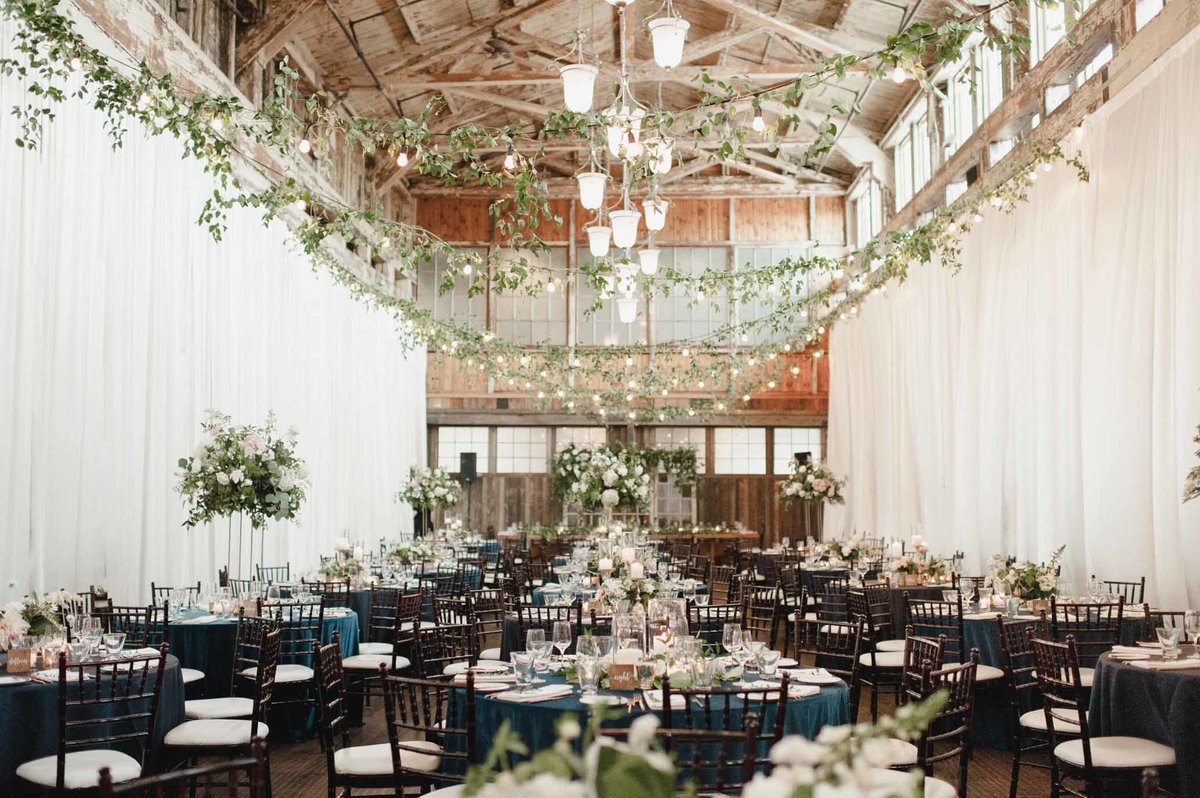 We love the look of the vines overhead softening this romantic wedding reception space.