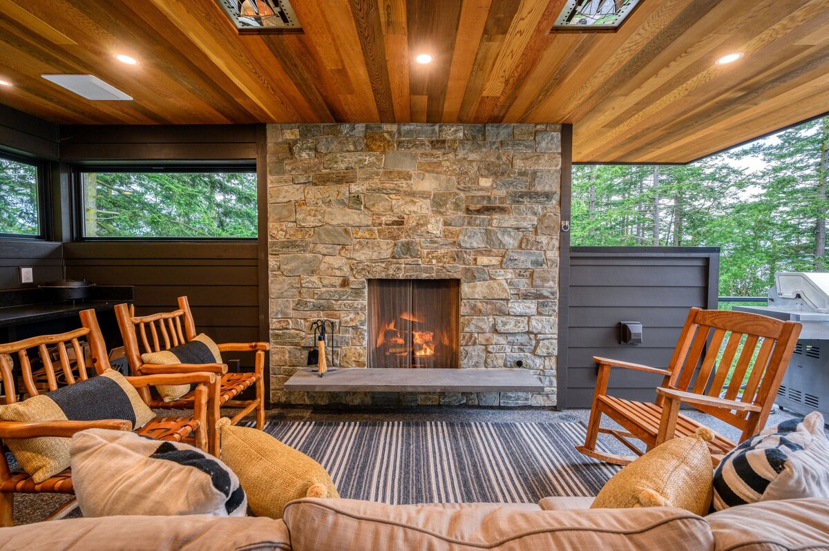 outdoor deck with stone fireplace