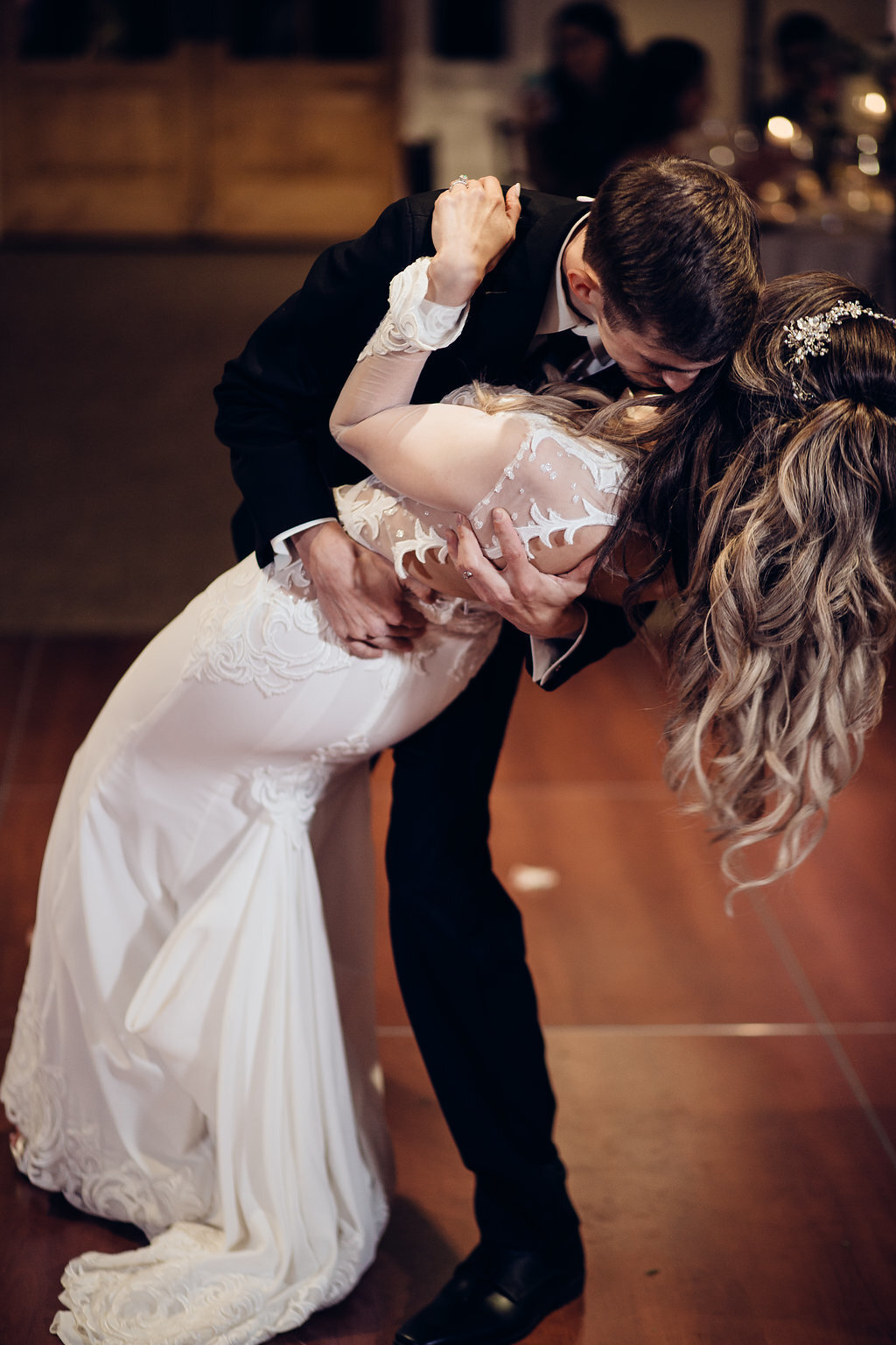 Wedding Photograph Of Bride And Groom Kissing While Dancing Los Angeles