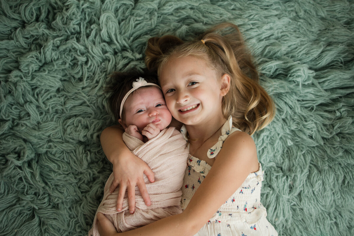 Newborn Baby and Sister