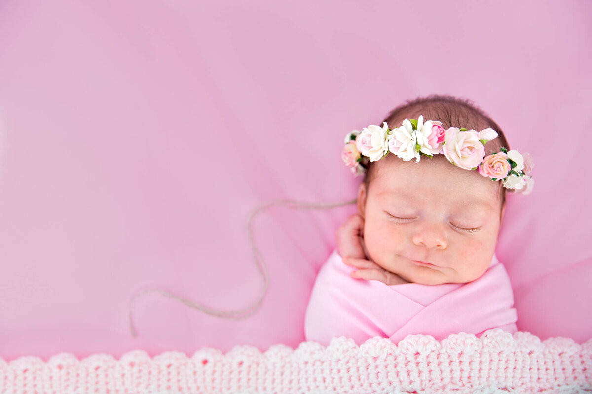 northern-kentucky-newborn-girl-pink-flowers-smiling