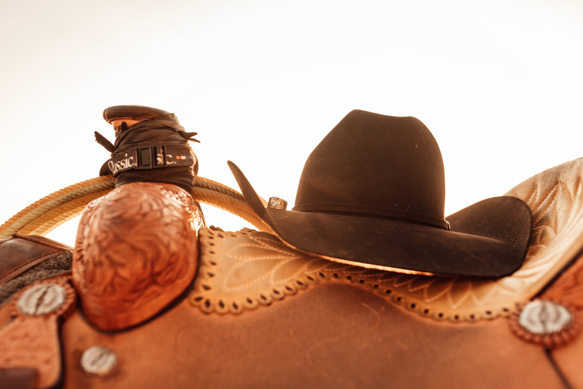 cowboy hat on saddle
