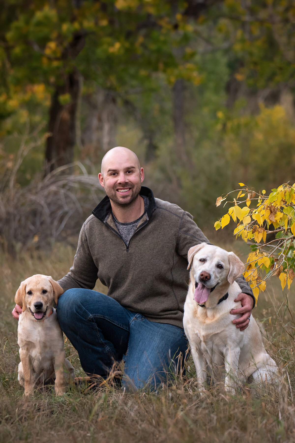 Man-Sitting-with-Two-Labrador-Retrievers-Parker-Colorado