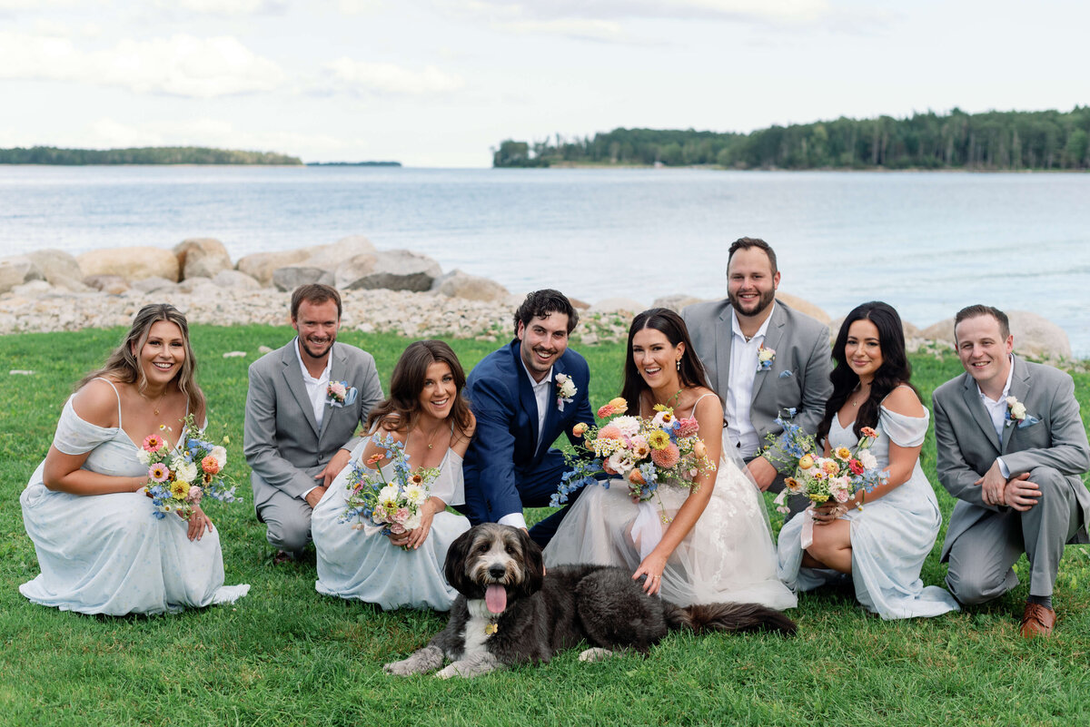 Bride anf groom with dog and bridal party at Oak Island Resort wedding, Nova Scotia