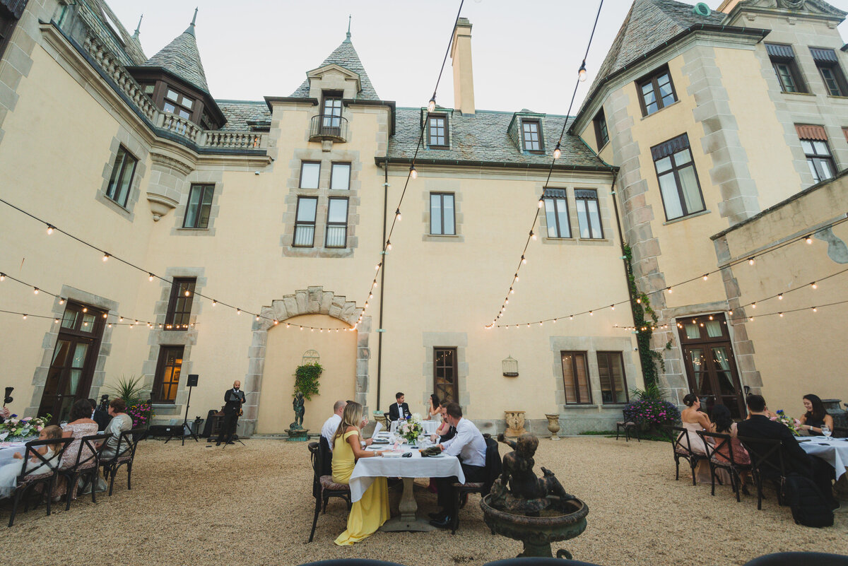 guests sitting in the courtyard at Oheka Castle