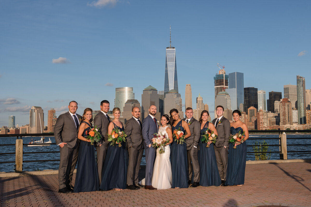 bridal party standing in front of the skyline at Maritime Parc