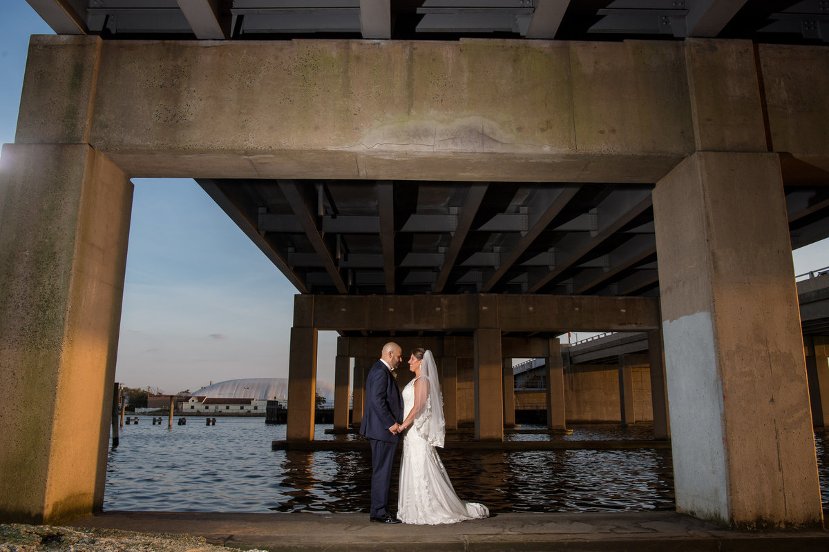 wedding photo of bride and groom outside under bridge at The Loft by Bridgeview