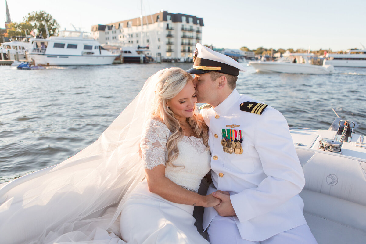 Annapolis wedding photo of Naval Academy bride and groom on boat in Chesapeake Bay by Christa Rae Photography