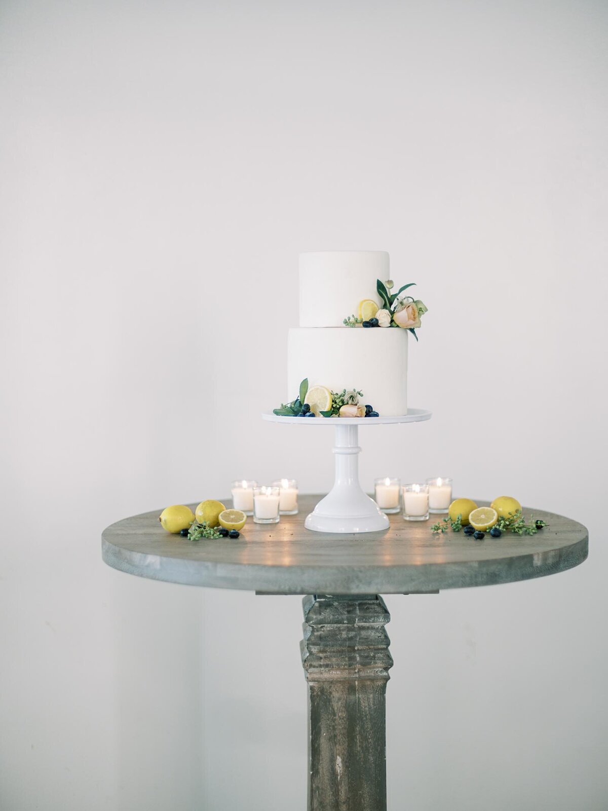 bluepansyfloral-yellow-pastel-lemon-blueberry-wedding-cake-table