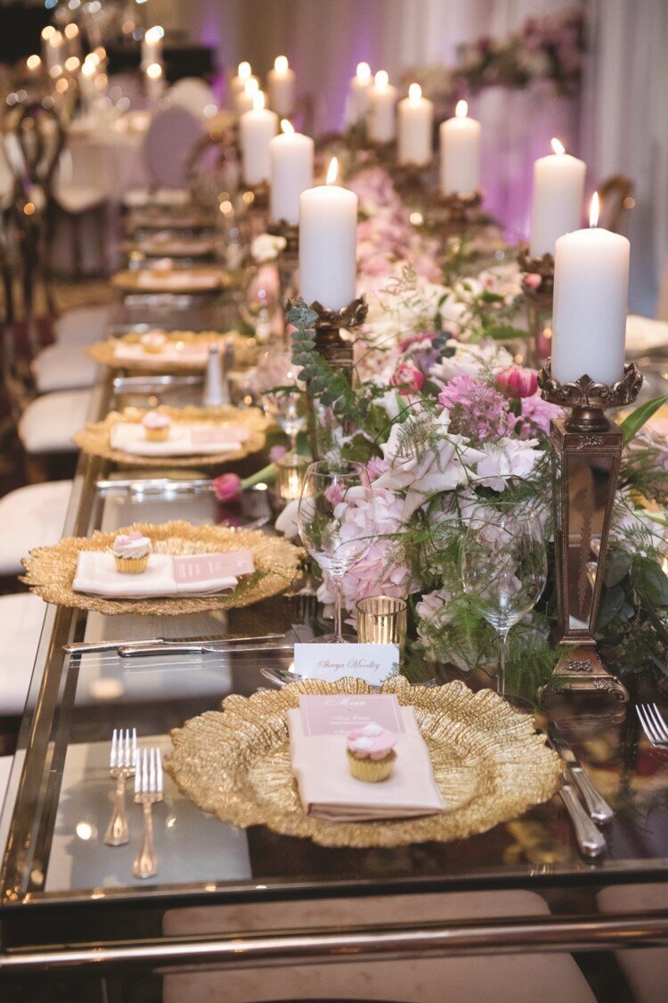 blush-gold-wedding-reception-chargers-cupcakes-candles-flowers