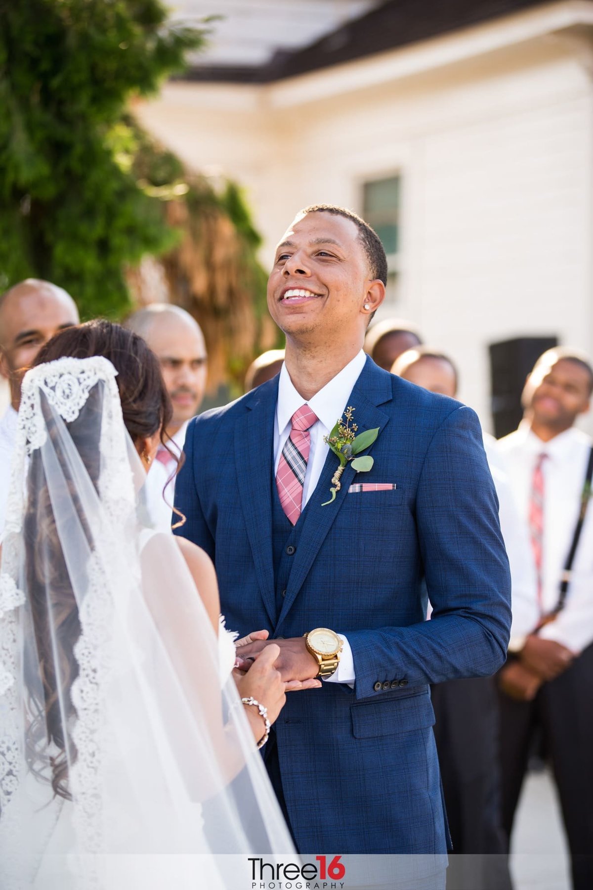 Groom laughs during the wedding ceremony
