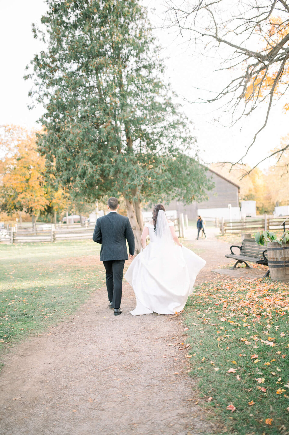 Bride and groom walking away captured by Niagara wedding photographer