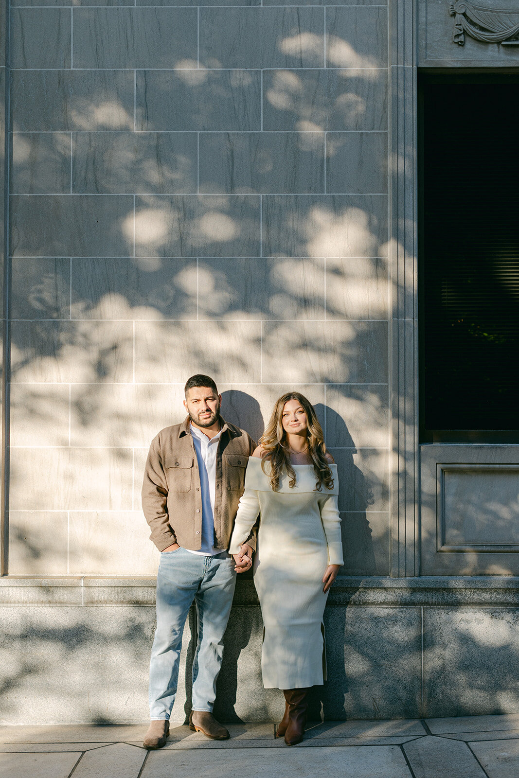 Couple embracing during golden hour engagement session in a Pittsburgh park