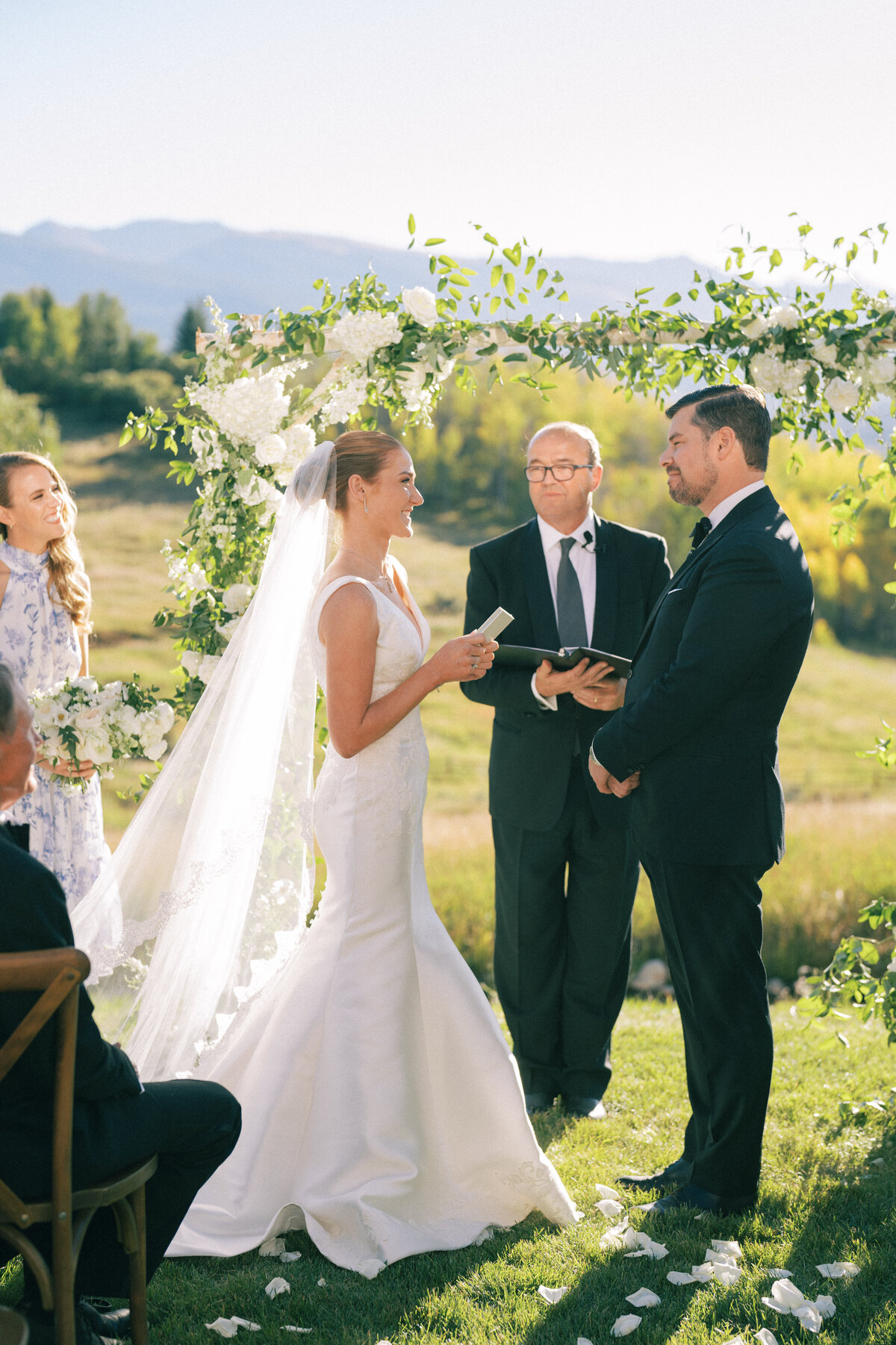 Bride and groom exchanging vows in Aspen