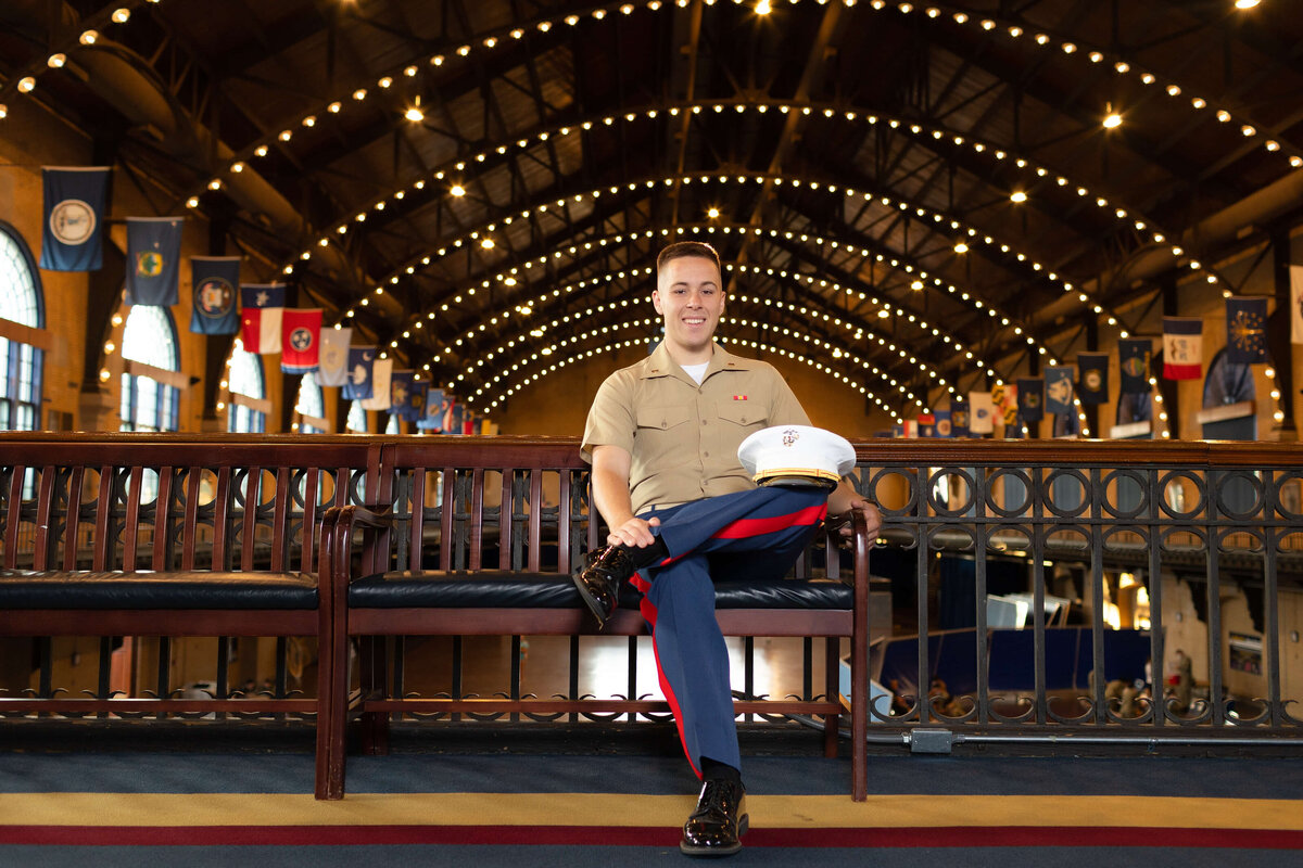 US Marine Corp Officer sits on a bench in Dhalgren Hall at Naval Academy in Annapolis, Maryland.
