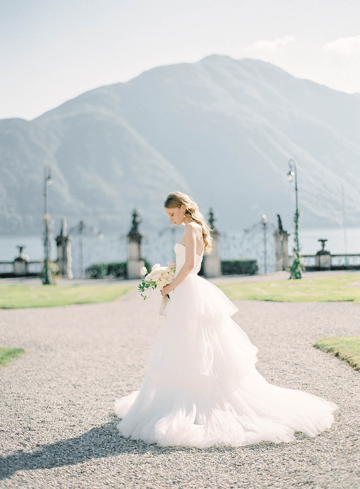 Bride in the front gardens of Villa Sola Cabiati for her Lake Como wedding photographed by Italy Wedding photographer