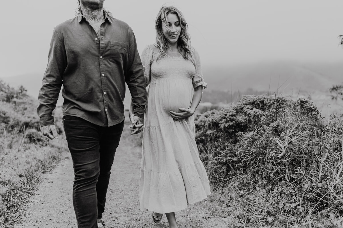 Black and White mom  pregnant and dad holding hands Emily Woodall Photography