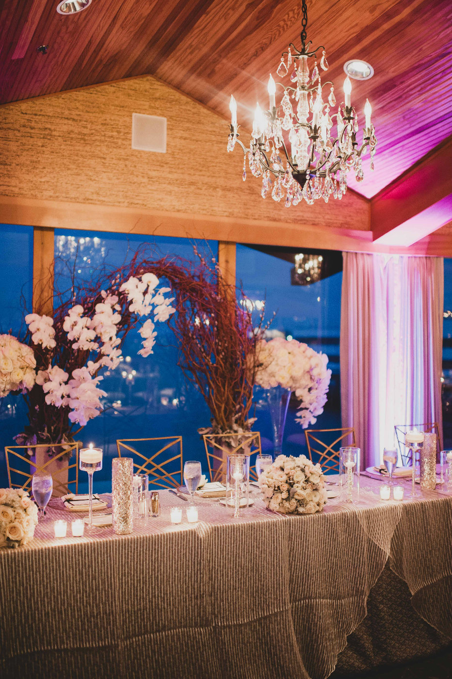 Beautiful Head table with white orchids at our winter wedding reception.