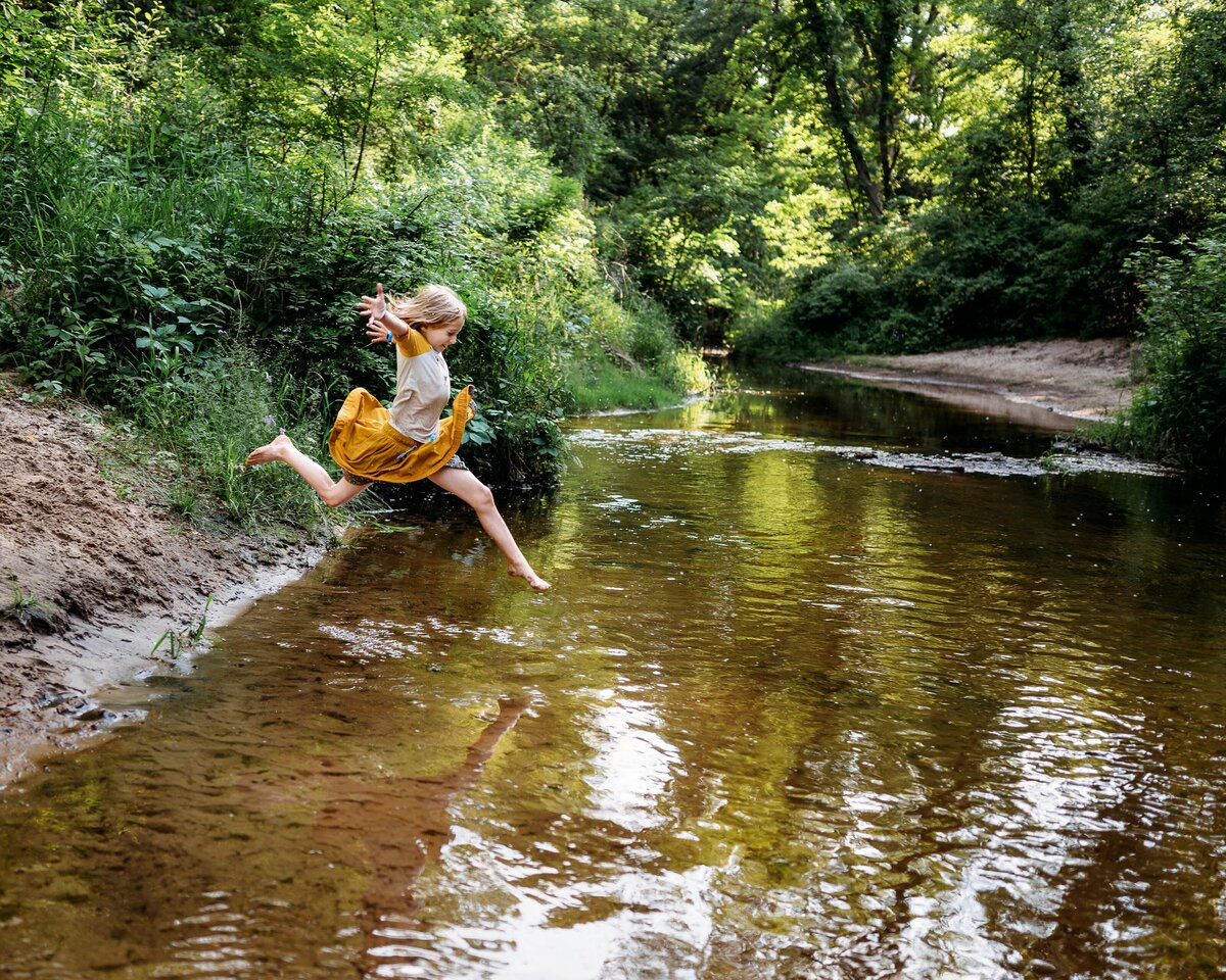 Child leaping into water McKennaPattersonPhotography
