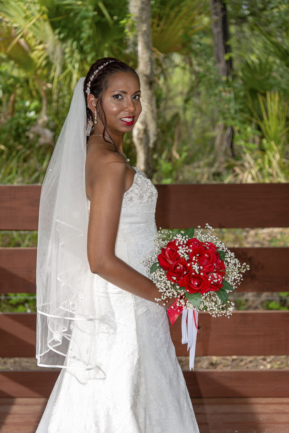 The bride poses for a bridal portrait