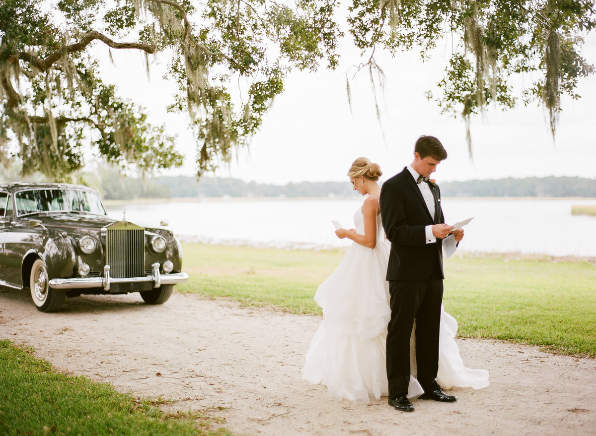 Bride and Groom Share Love Notes before Charleston Wedding Ceremony 1961 Grey Rolls Royce Lowcountry Valet