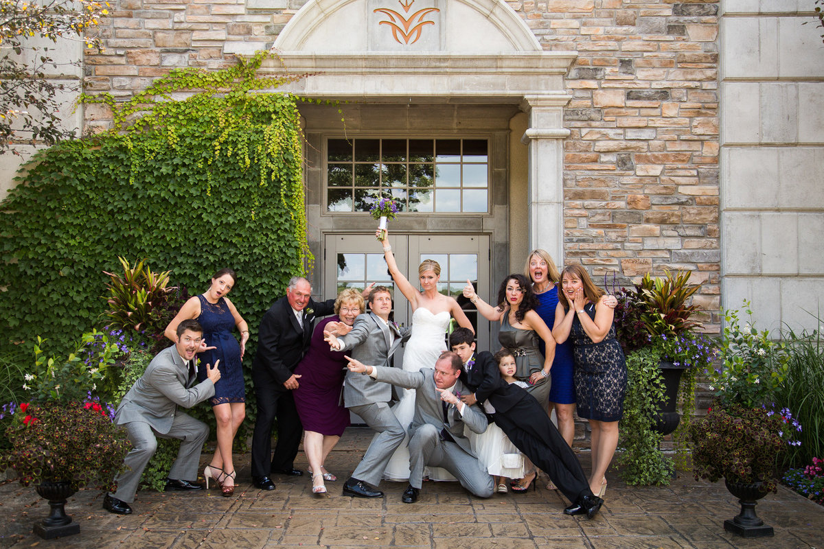 Sombery wedding photography with a formal shot of a family where they just straight up goofed off