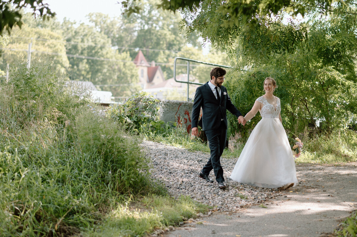couple walks together on their way to their ceremony