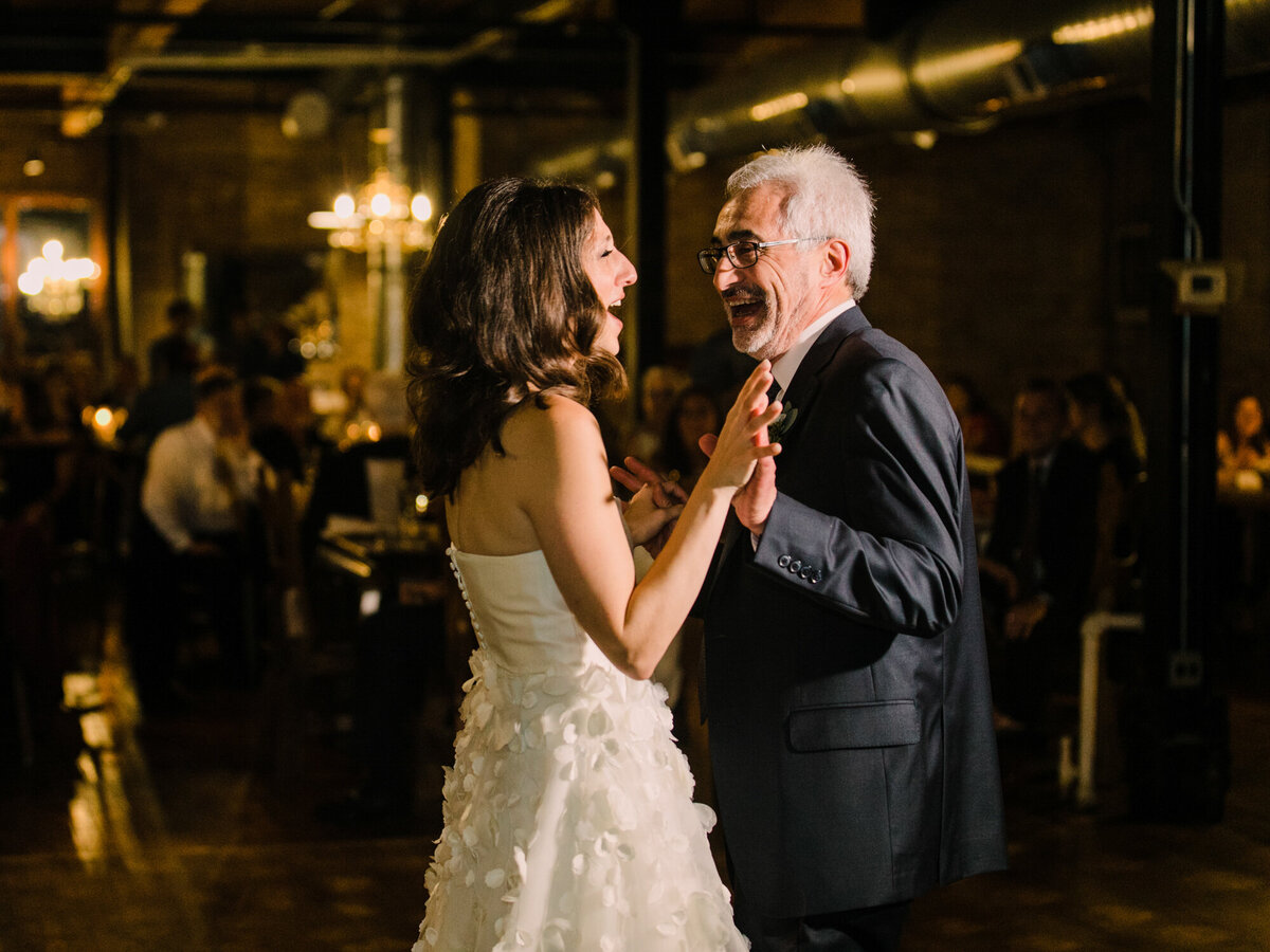 A father shares a special dance with his daughter on her wedding day at Salvage One in Chicago