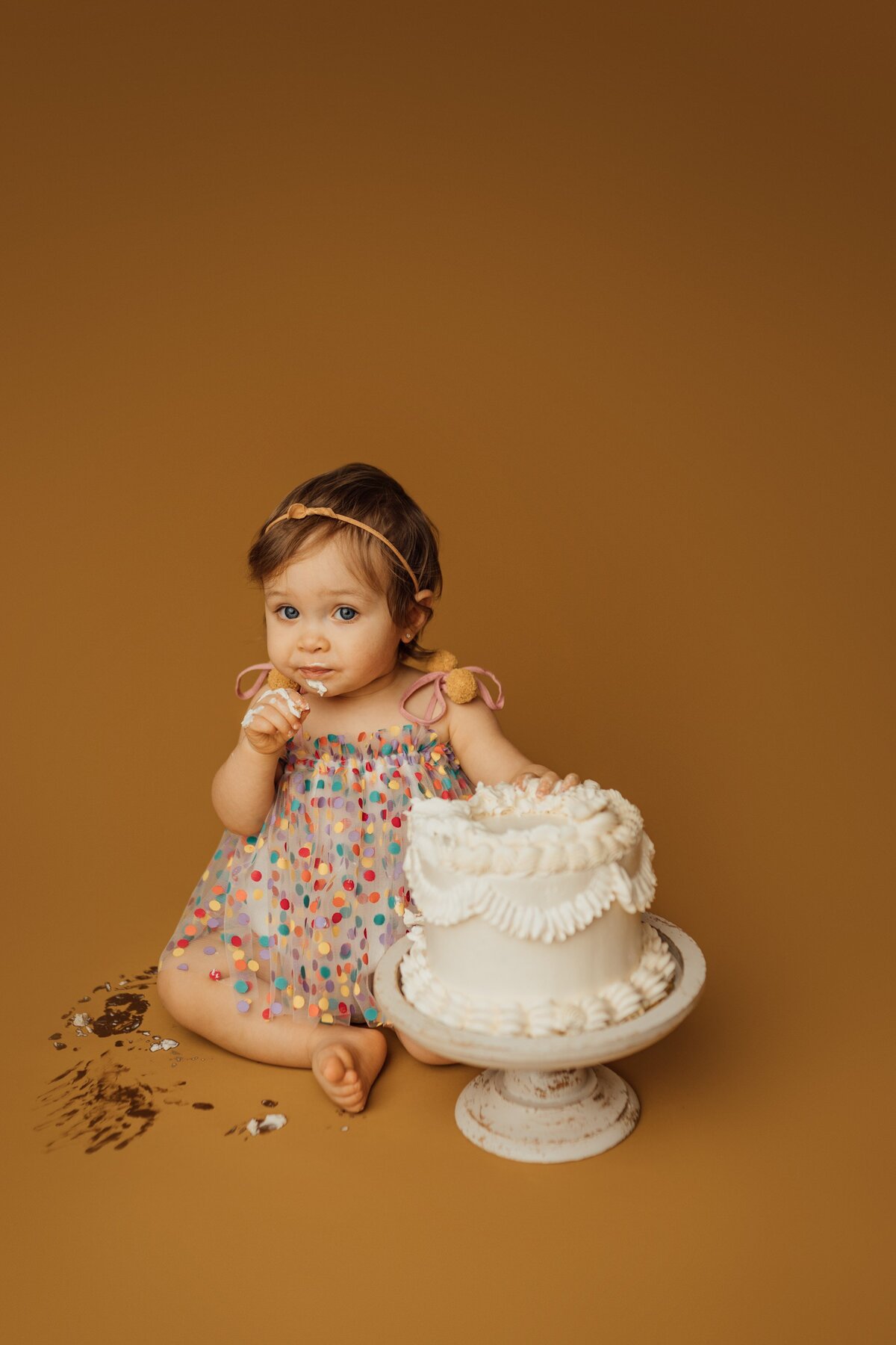 girl during cake smash photography session in Tampa