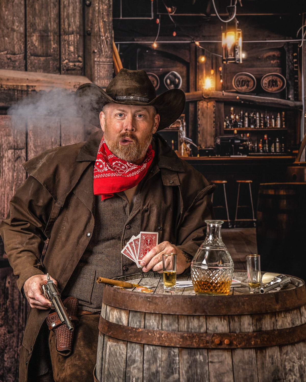 Cinematic fine art portrait of a modern cowboy captured in a vintage Western saloon set, styled and photographed at AMM Fine Art Studio in Kirkland.