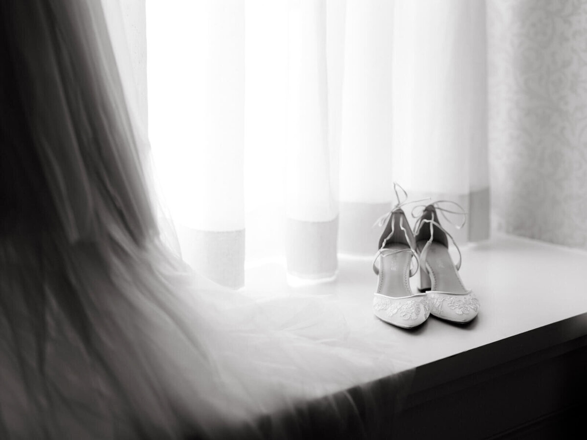 Wedding shoes with white curtain on the background