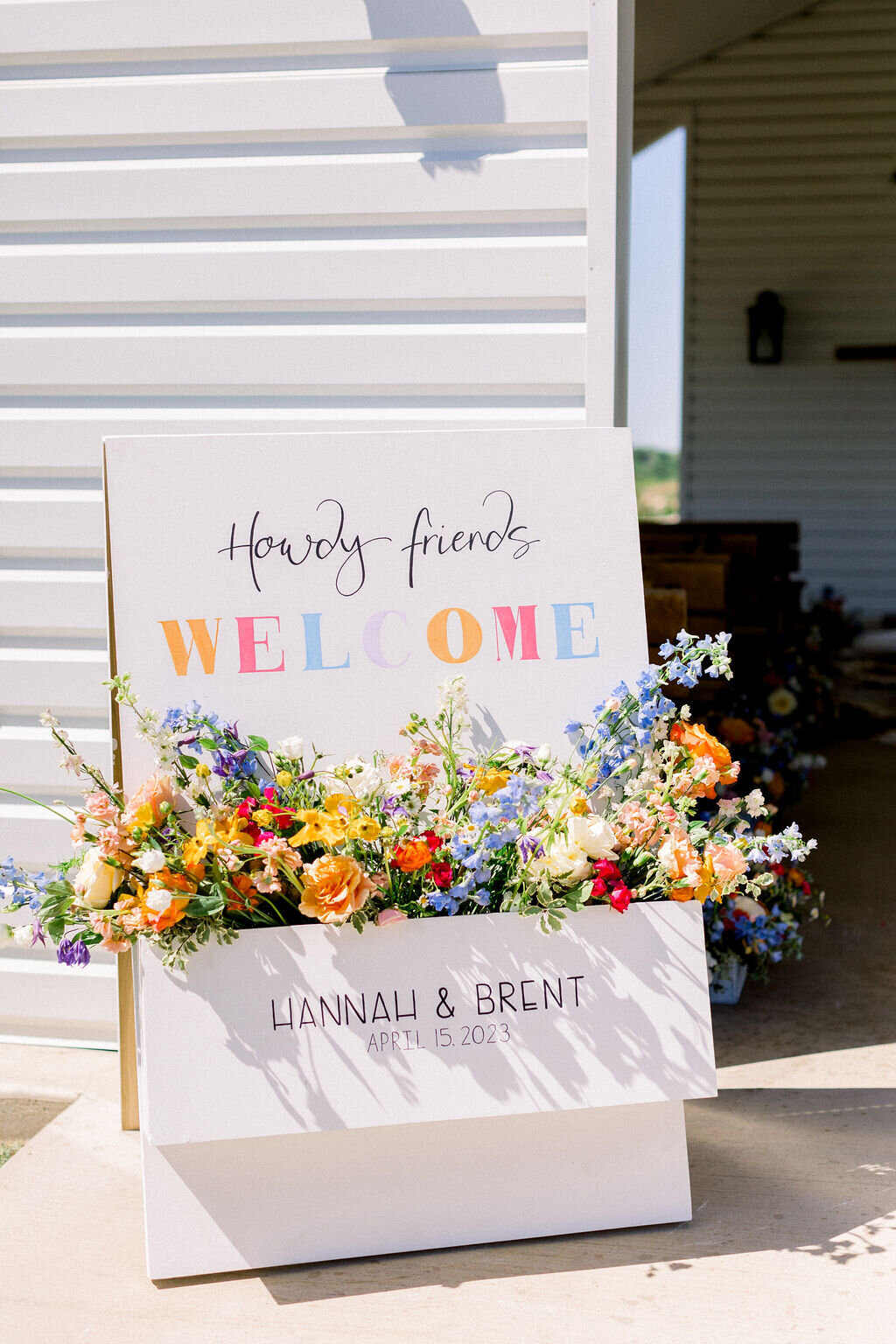 handmade welcome sign planter with bright flowers