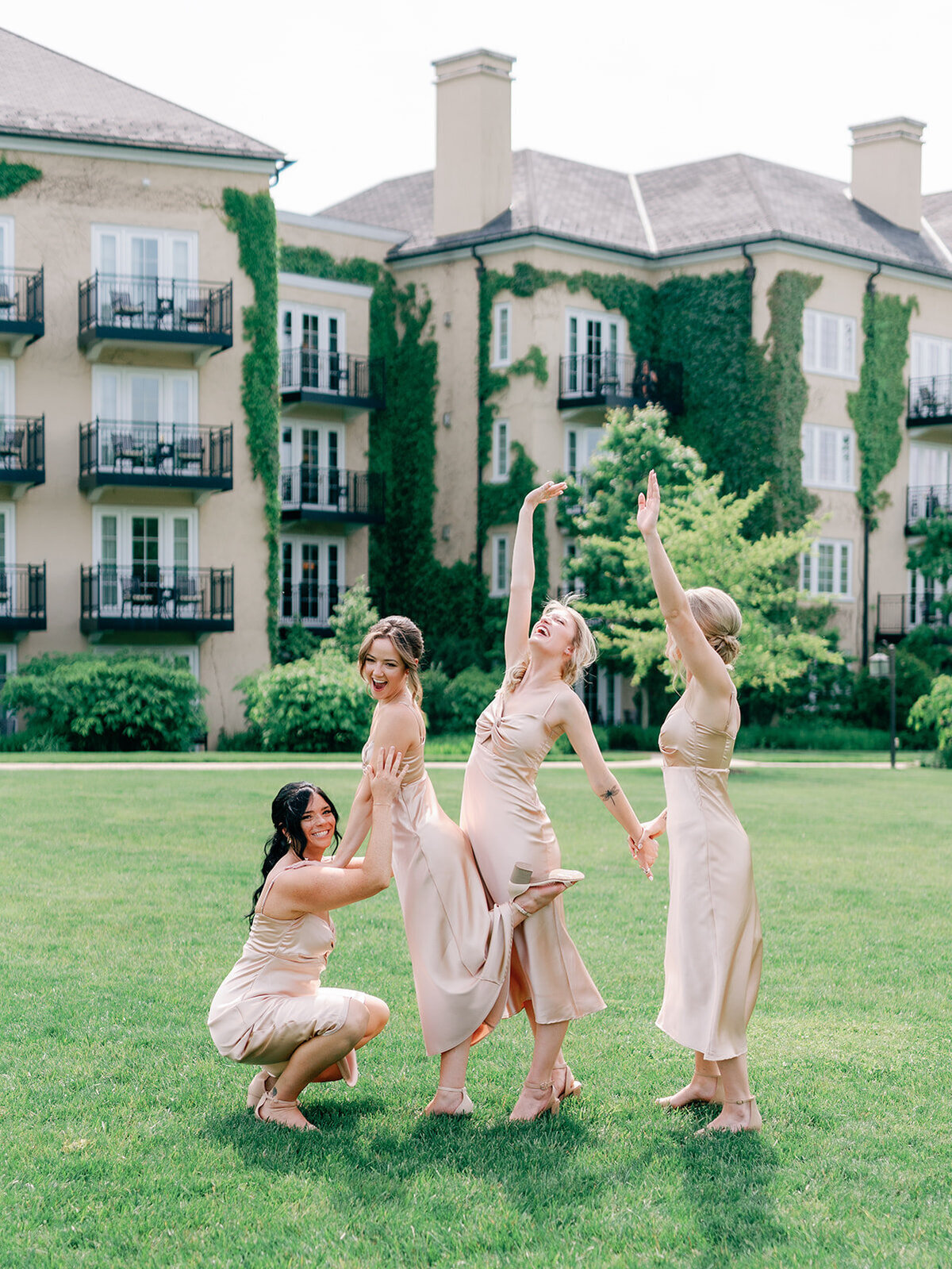 Girls celebrate on the lawn of Salamander Resort wedding
