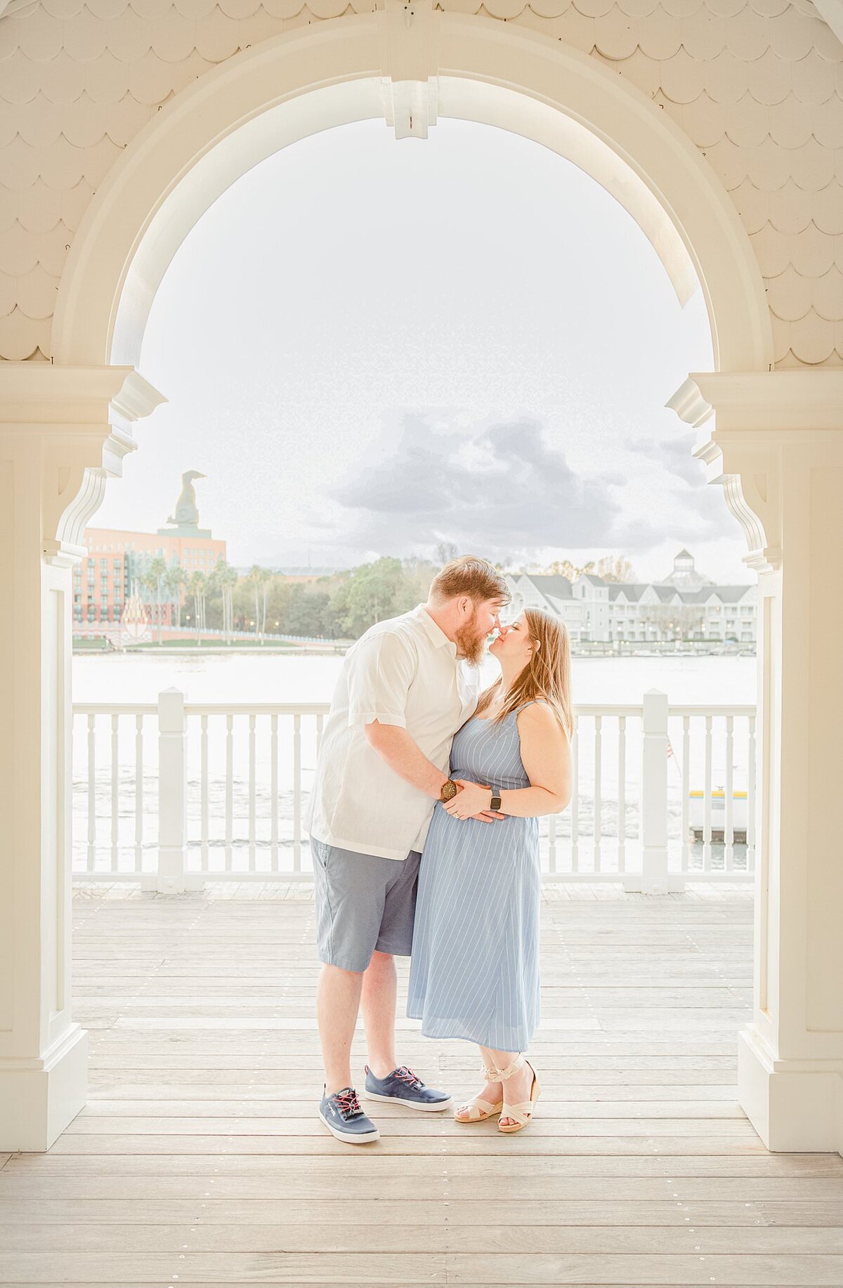 Engaged couple kiss at Disney's Seabreeze Point at Disney's Boardwalk