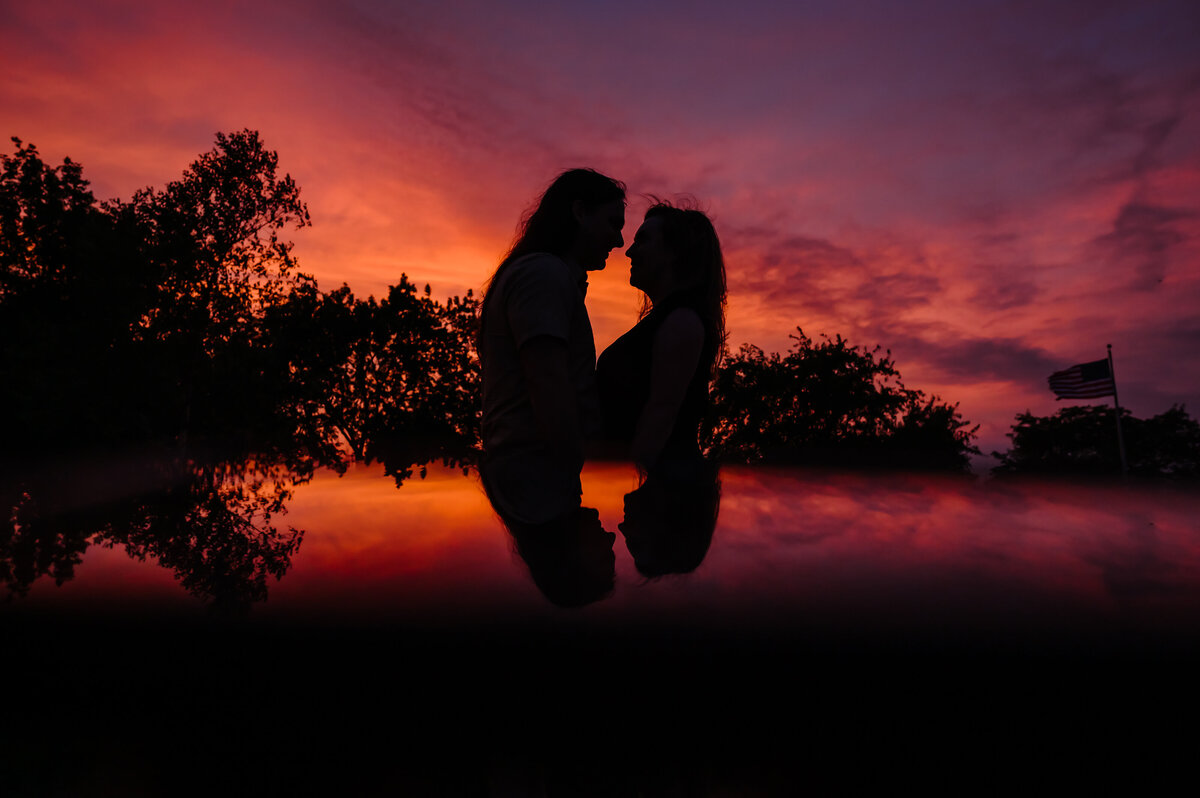 A couple is reflected during sunset