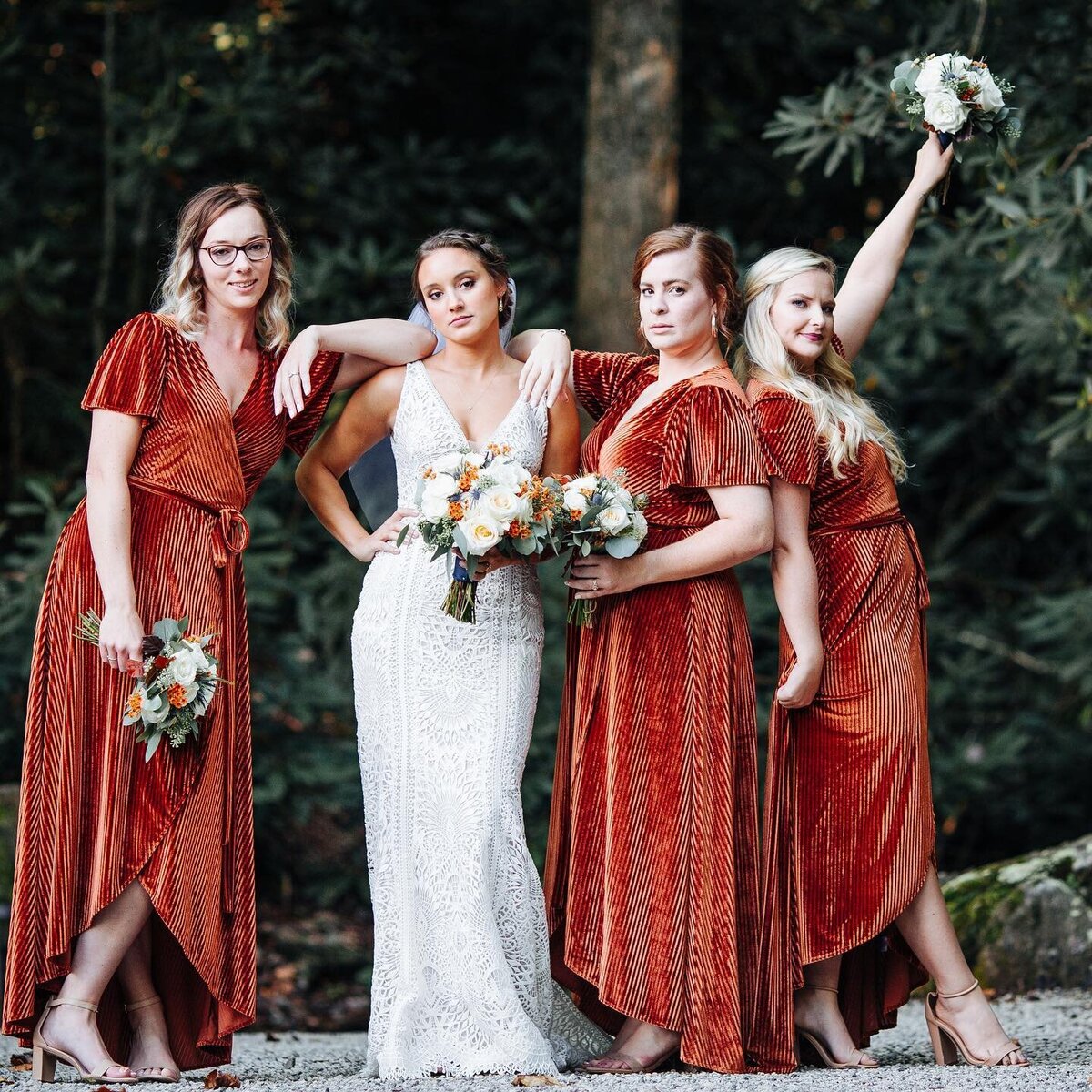 bride with bridesmaids in cinnamon red dresses