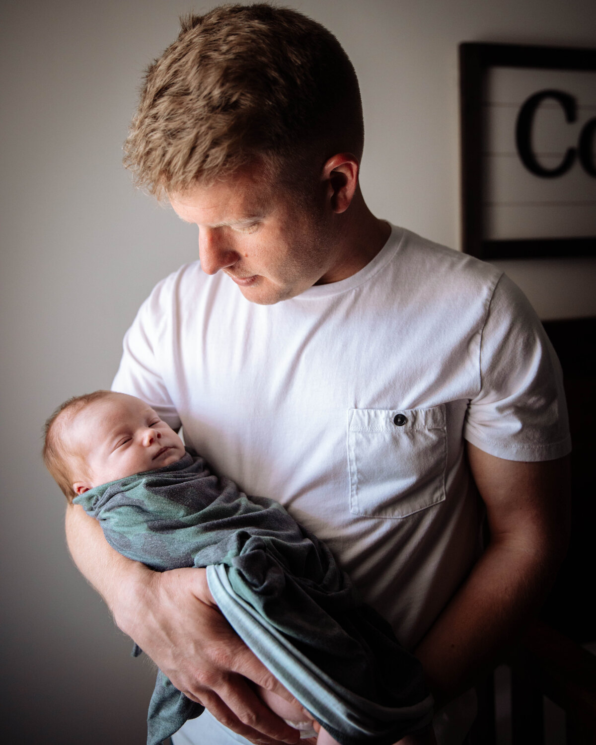 Daddy holding his newborn baby boy