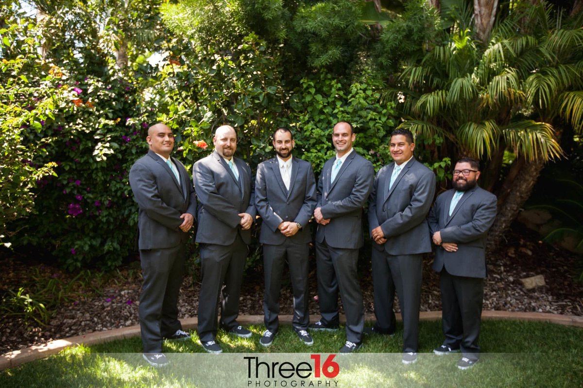 Groom poses with his Groomsmen