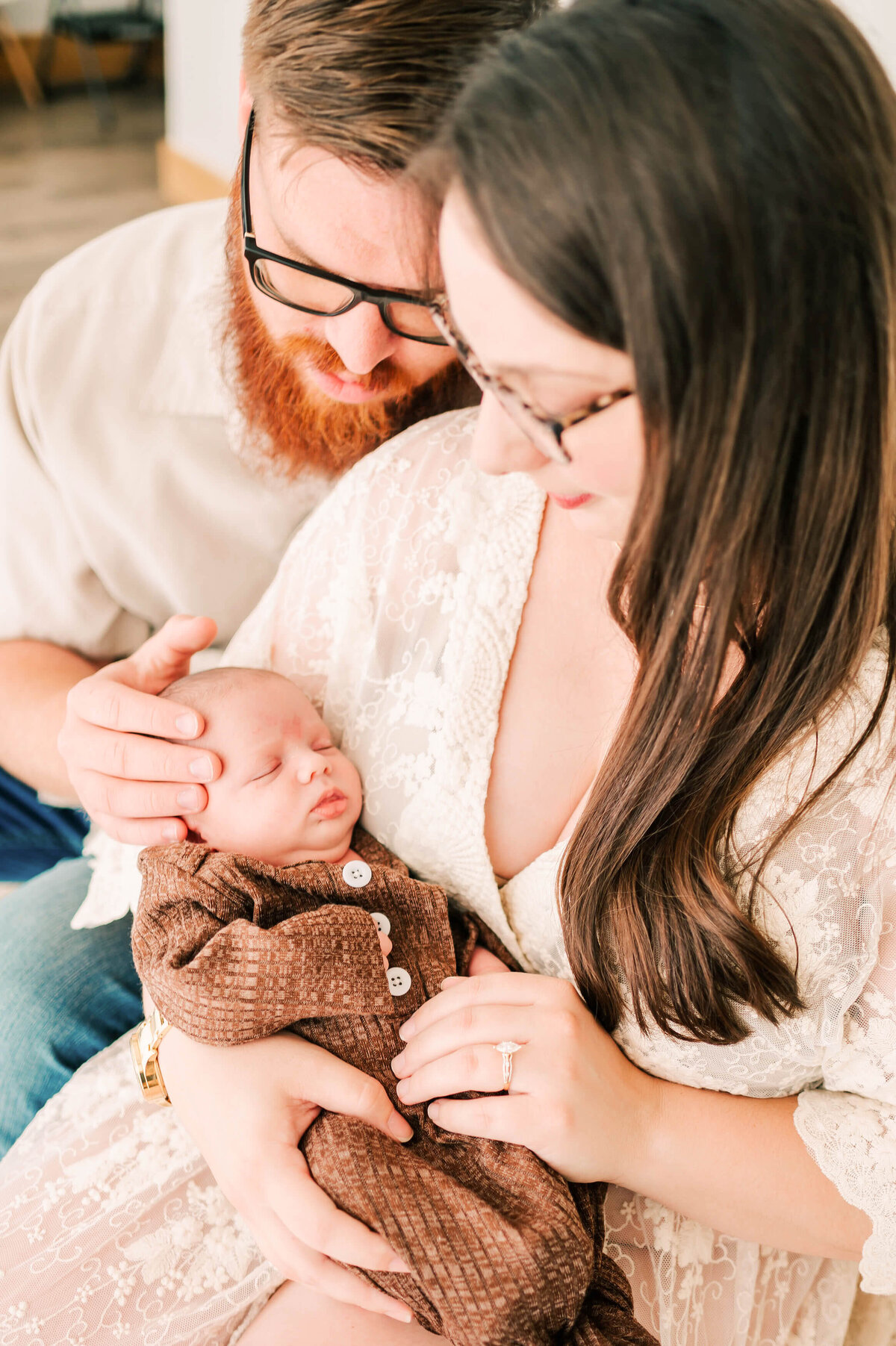 newborn photo in Springfield MO of family holding newborn in arms