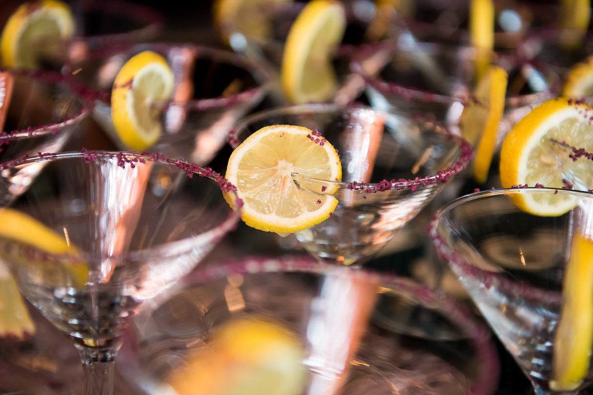 Purple signature cocktails with lemon