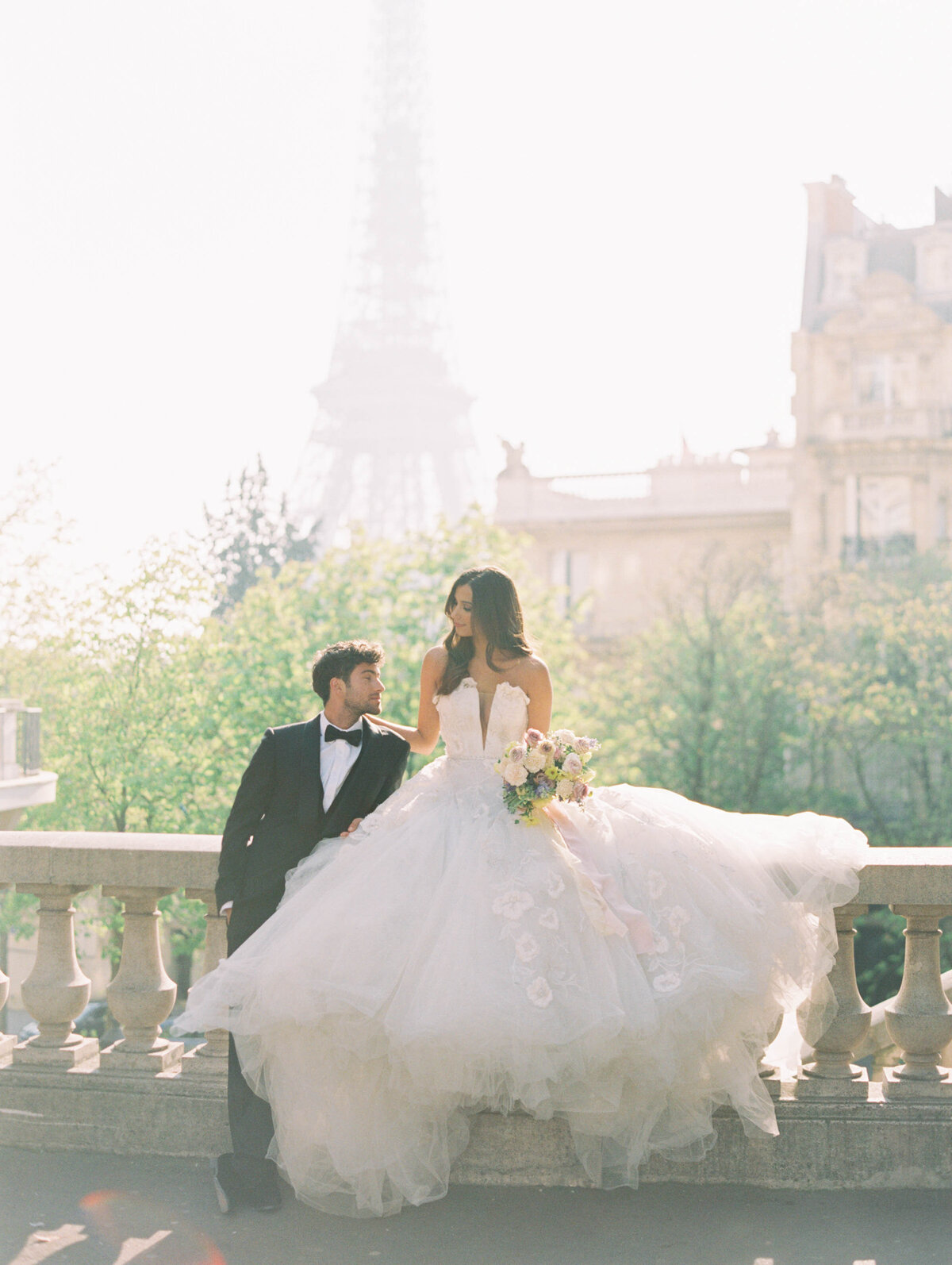 Bride and groom with Eiffel Tower in Paris, France