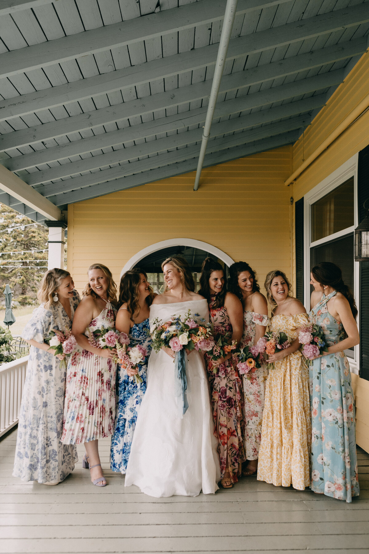 Bride and bridesmaids with colorful bouquets at New England Wedding