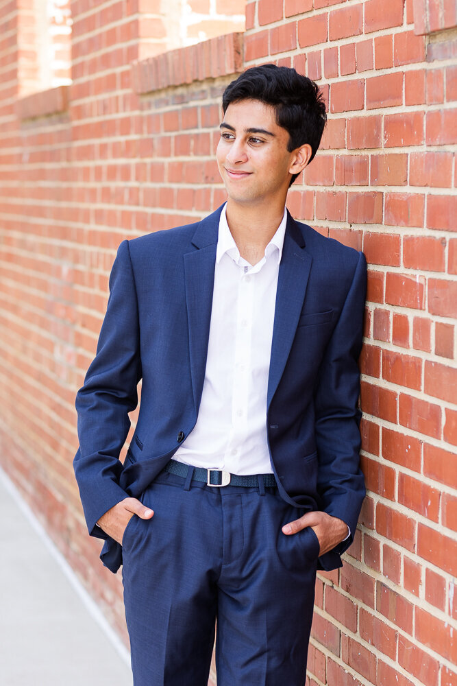 Classy high school  portrait session of a senior guy in a suit in Raleigh, NC.